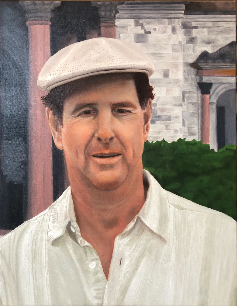Self-portrait of Joaquin Garza wearing a cap and a light shirt